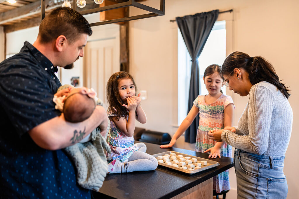 Family is making cookies during a documentary family photography session.